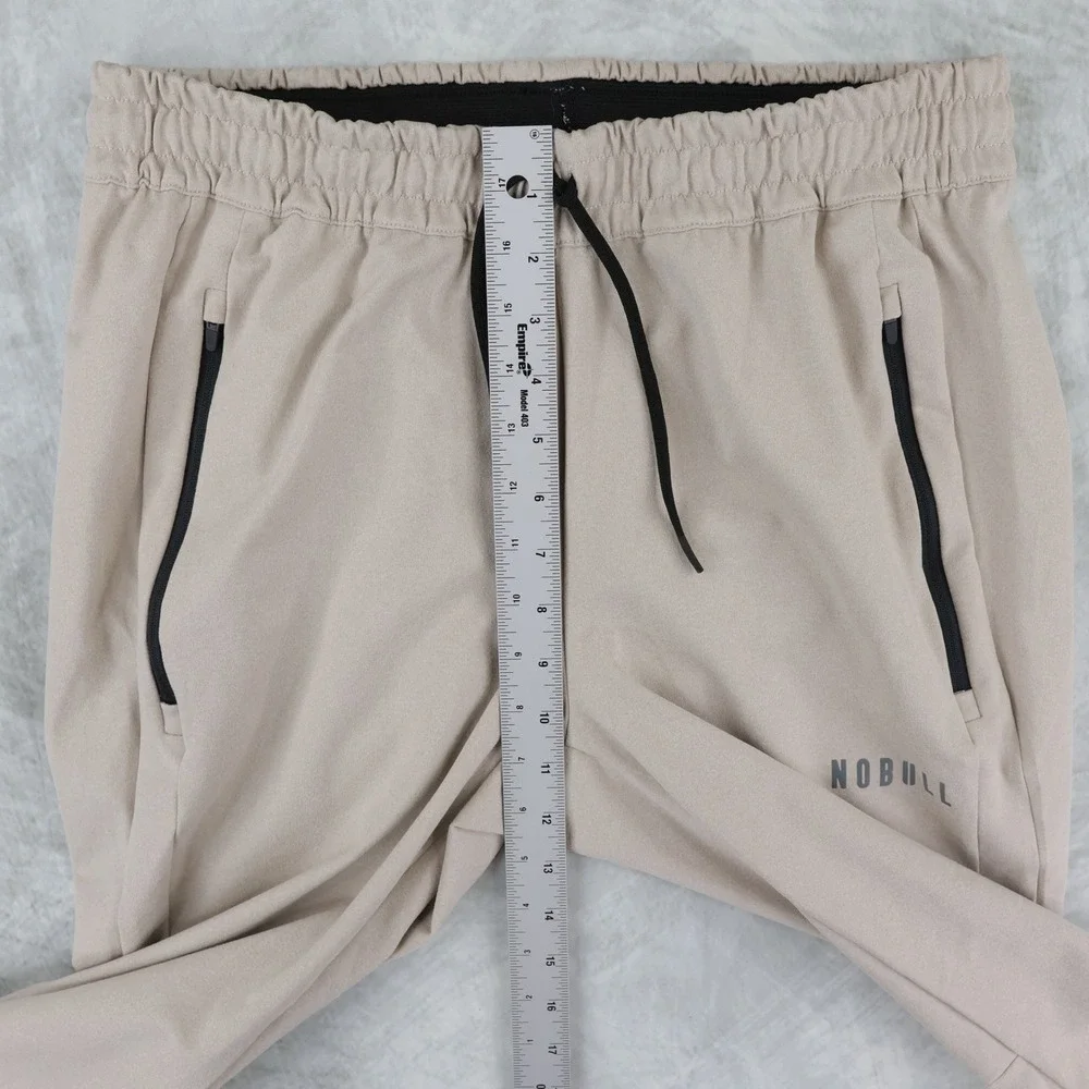 NOBULL Jogger Pants Mens Medium Tan Zipper Pockets Tapered Training Sweatpants